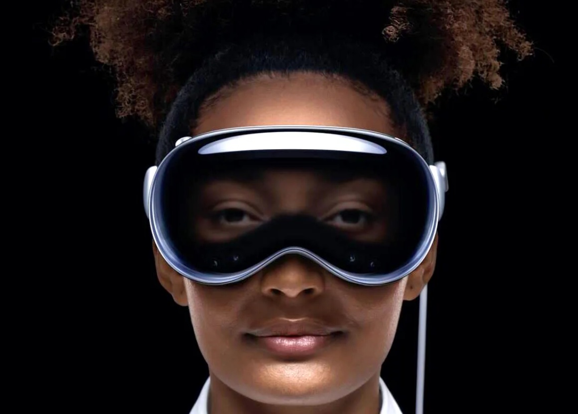 A strong black woman wears apple's vision pro goggles